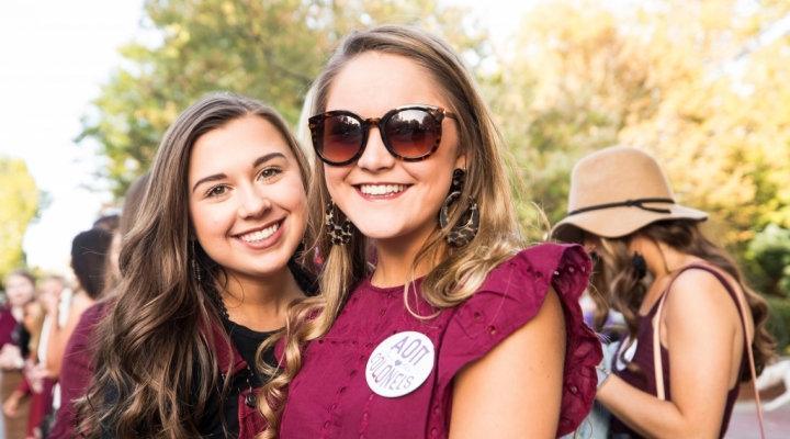 students pose in the Homecoming Parade